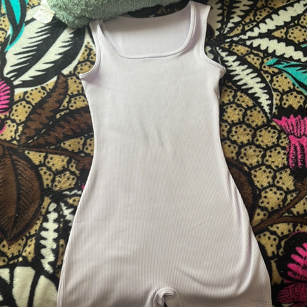 I’m selling a purple stretchy jumpsuit